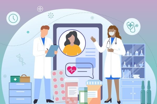 A doctor and a patient are standing in front of a tablet with a phone on it.